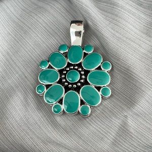 Premier design necklace pendant. Two sided. Blue and red.